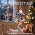 Baby lying in crib reaching for a hanging mobile with plush animal toys including panda, cat, and bird; mobile features a 30° tilt design for sleeping position, promoting grasping, swatting, and reaching.