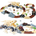 Dinosaur-themed race track set featuring a large T-Rex fossil truck centerpiece, flexible brown and beige tracks, battery-operated dino cars, various dinosaur fossil figures, track accessories, and ramps for imaginative play.