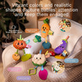 A collection of colorful fruit and vegetable baby toys, including a carrot, tomato, cauliflower, and eggplant, showcasing interactive features like crinkle paper, pull rings, and squeaky sounds. Perfect for sensory and developmental play.