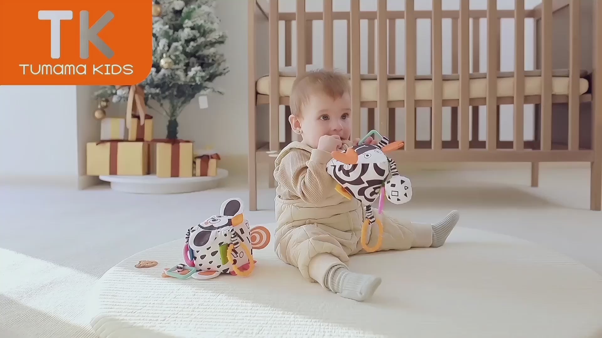 Baby-sitting-on-the-floor-playing-with-soft-cube-and-triangle-toys