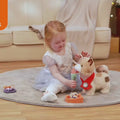 little girl interacting with the electric cat toy