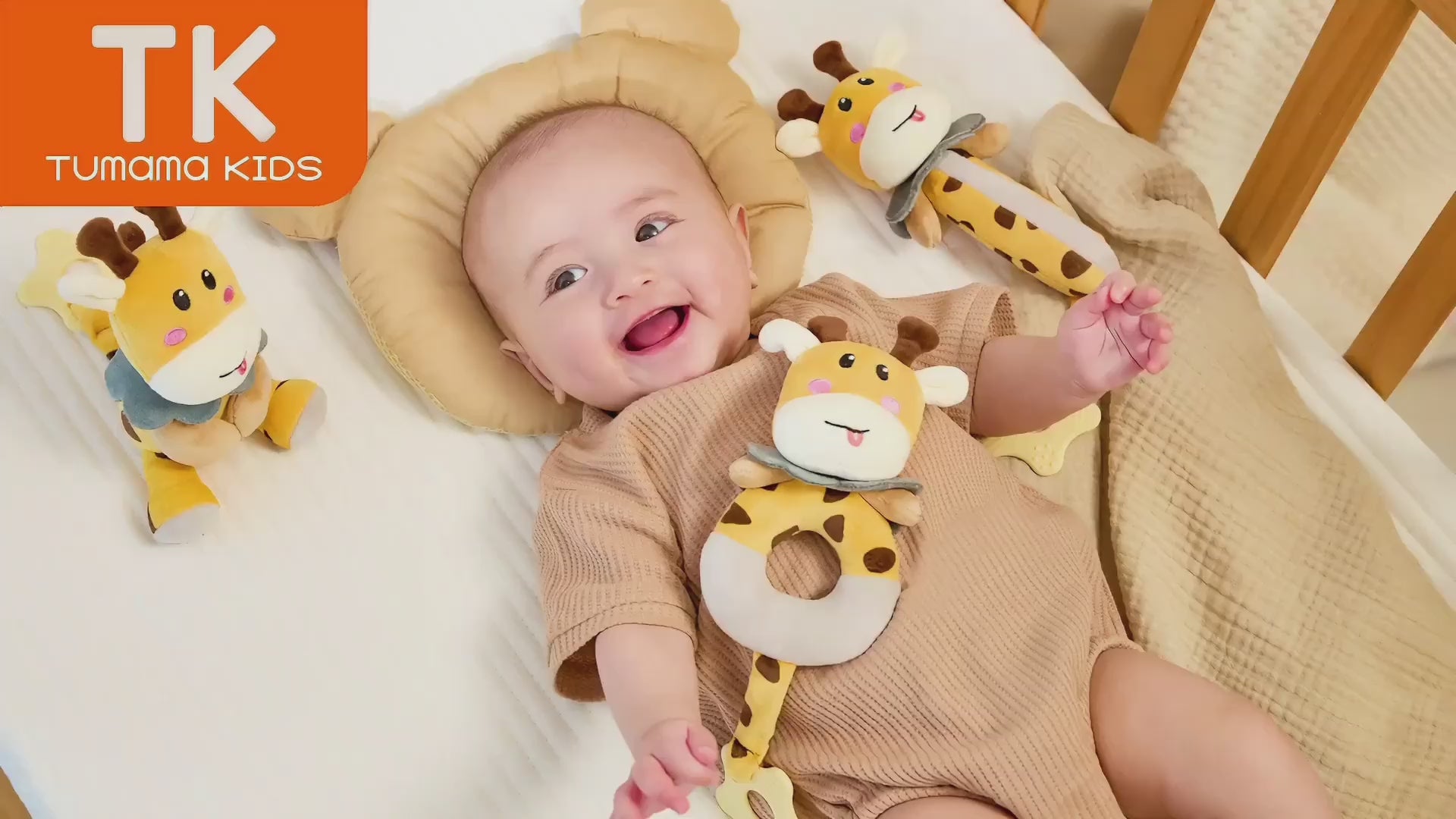 Baby-playing-and-chewing-with-the-soft-giraffe-rattle-toy